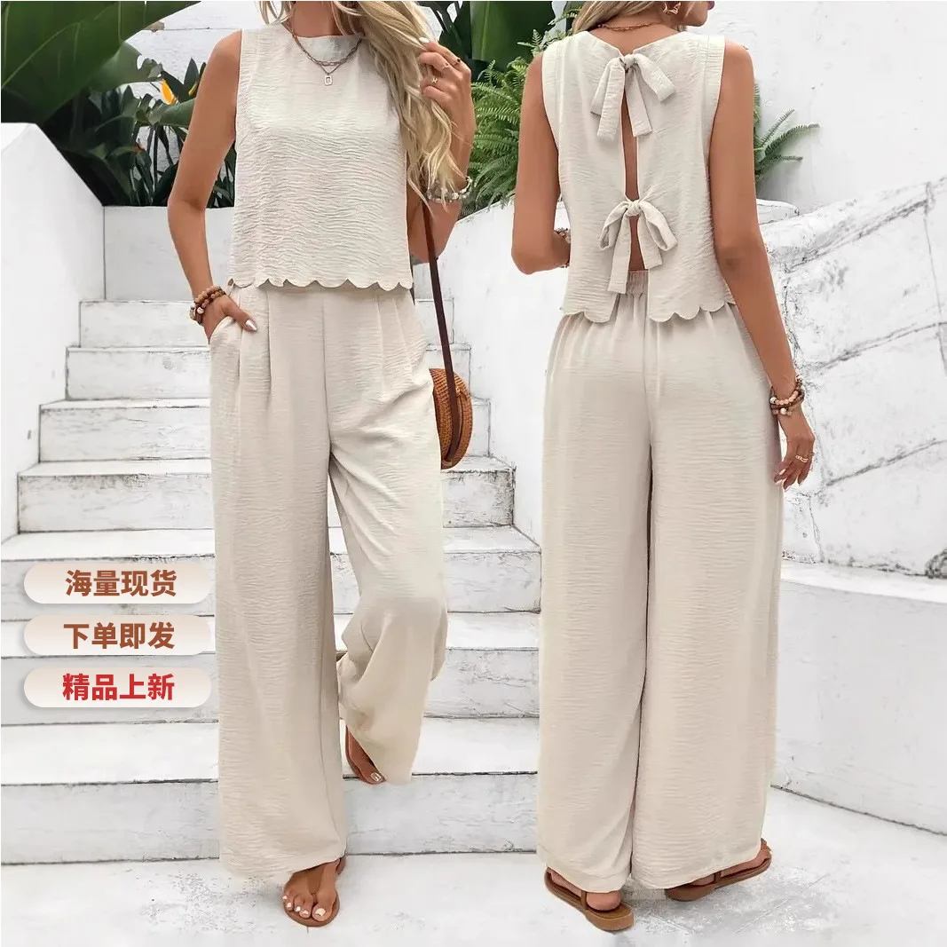 

Новинка 2026 года: европейско-американский весенне-летний комплект из однотонной футболки и широких брюк на шнуровке, французский элегантный стиль.