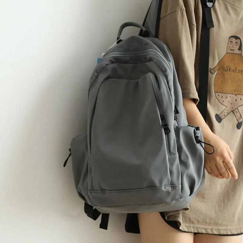 New solid-color versatile backpack, large-capacity schoolbag for junior high school and college girls, casual travel rucksack