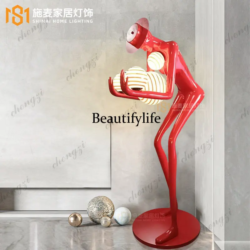 Modern abstract bending over and holding the ball, figure statue, floor lamp villa hotel living room, fiberglass ornament
