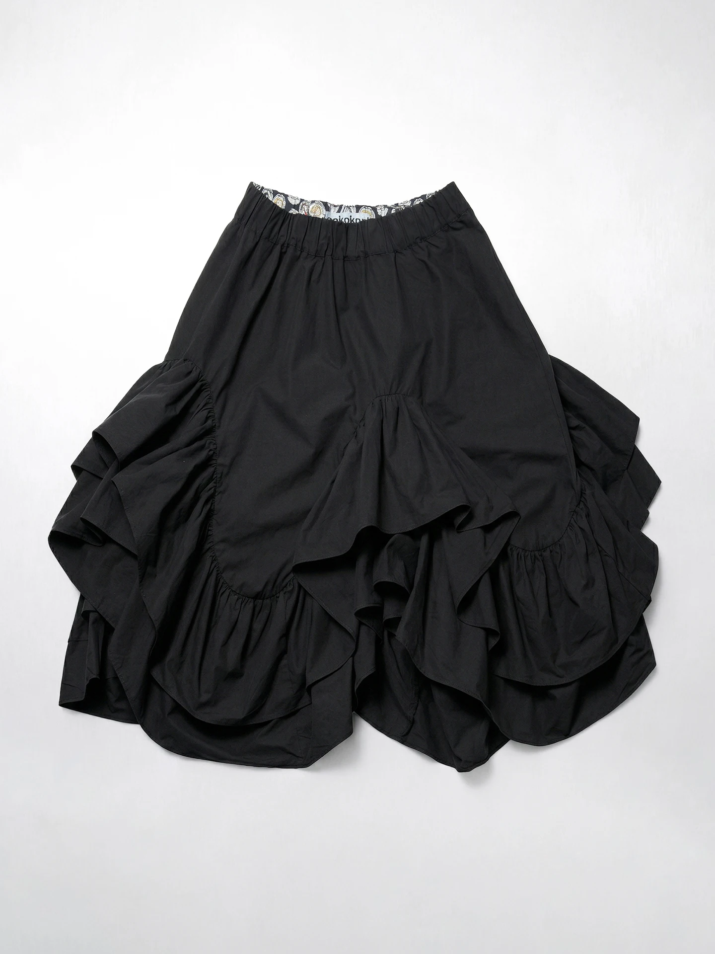 

Black midi skirt for women imakokoni 2026 Spring Forest style high waist irregular ruffle edge mid length skirt 265401
