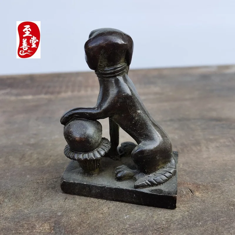 Antique collectible, old patina, imitation antique alloy copper living room decoration, dog holding a ball, seal with inscriptio
