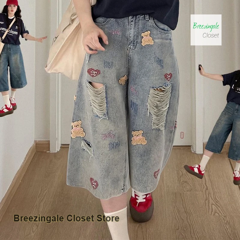 

Korean style retro bear embroidery hole denim shorts female summer new fashion hole casual loose slim wide leg cropped pants.