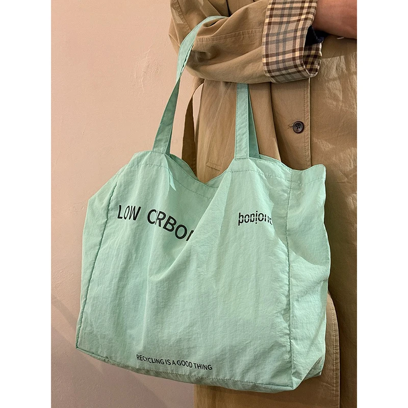 

Women 2025 New Fashion Letter Canvas Tote Bag Trendy Large Capacity Leisure Shopping Bag for Student and Daily Use