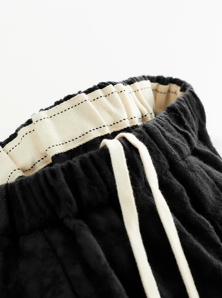 Falda de paraguas versátil ~ Tela Jacquard de lana 100% Otoño e Invierno Nuevo producto 2025 Media falda Falda negra Falda de capullo de flor alargadora de piernas para mujer