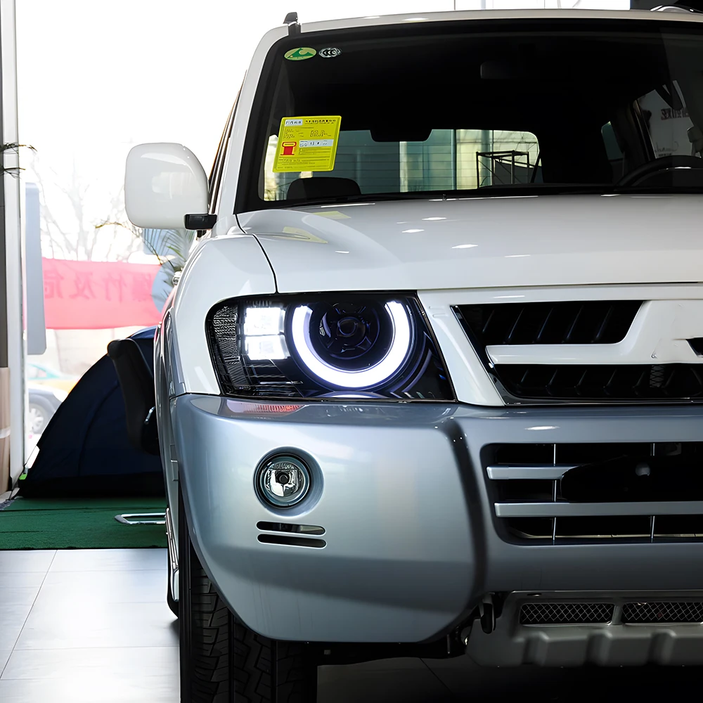 

Для Mitsubishi Pajero V73 2004-2014 светодиодные автомобильные фары в сборе, обновленный стиль Defender, динамические линзы проектора, автомобильные аксессуары