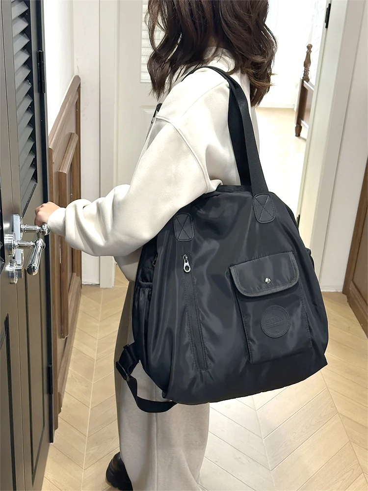 

Сплошной цвет, нейлон, новинка 2024 года, студенческие рюкзаки на молнии, популярная повседневная сумка на плечо, мягкая универсальная дорожная сумка для спорта