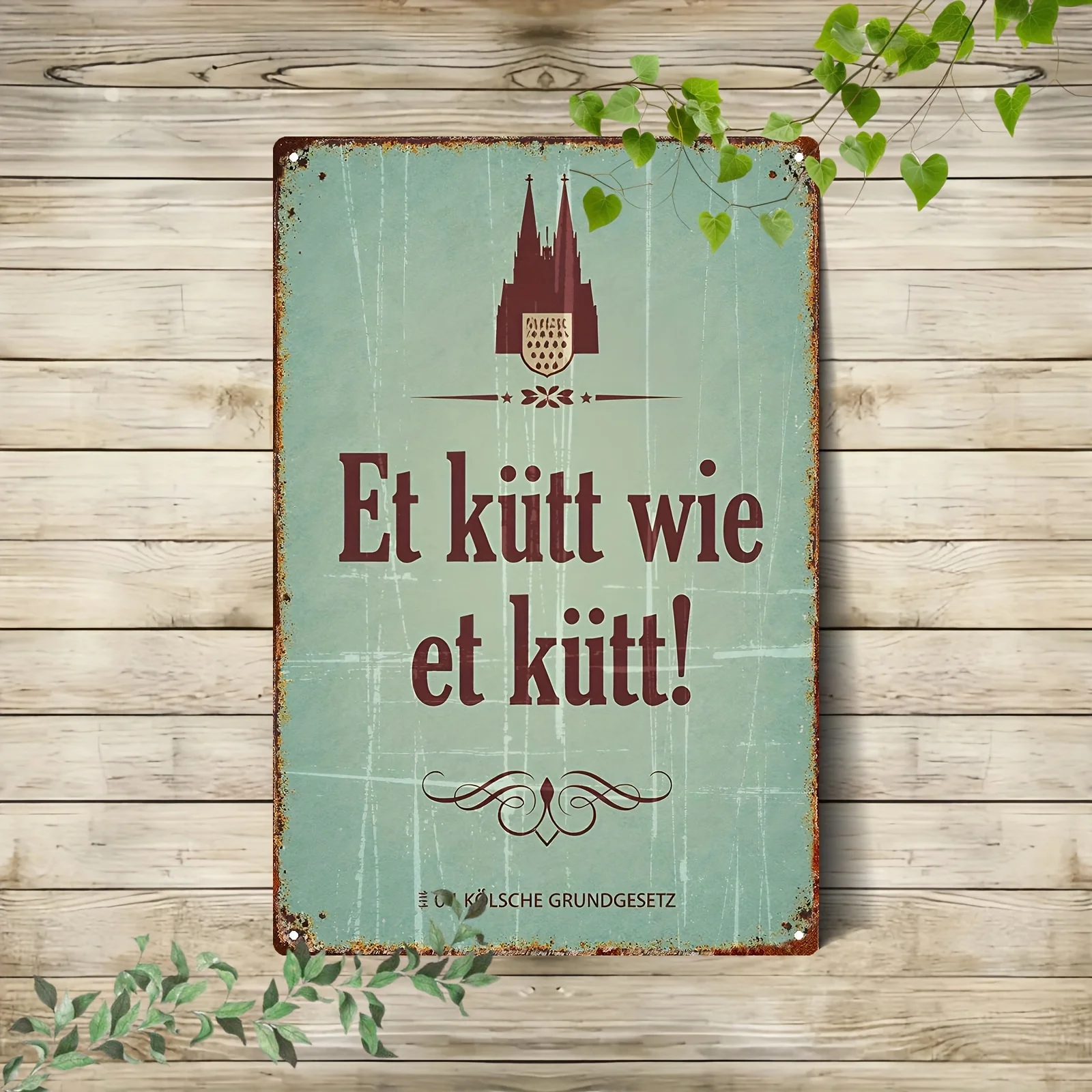 Letrero Metálico Plano 2D con la Catedral de Colonia y un Eslóganes Humorístico Alemán, Diseñado en Estilo Europeo Vintage