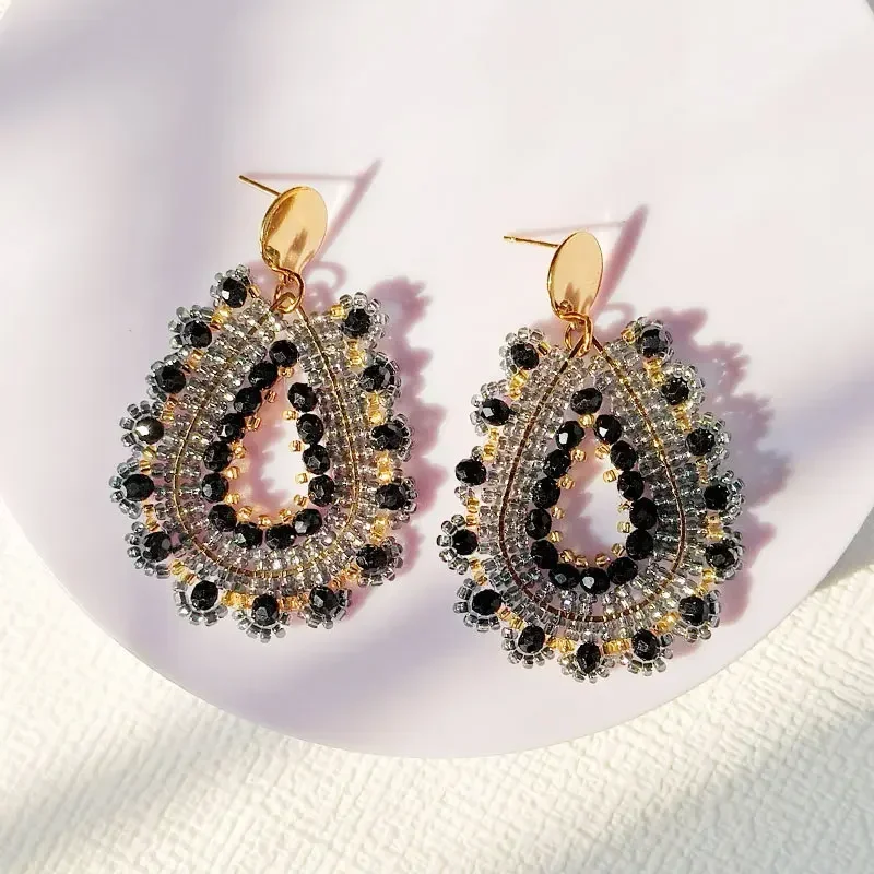 Beaded earrings Black. Originality Water drop Crystal Hollow out Flowers Hand knitting Bohemia Tide Simple Rice bead earrings