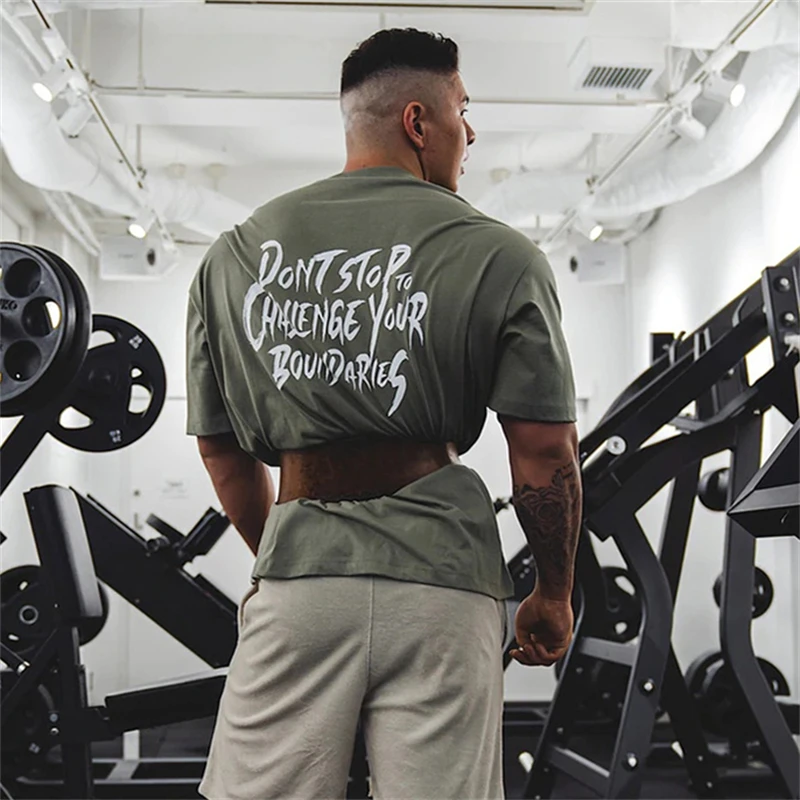 Siłownia koszula mężczyzna sportowe do biegania luźne T-shirt bawełna Tee topy letnie męskie trening kulturystyczny treningu odzież