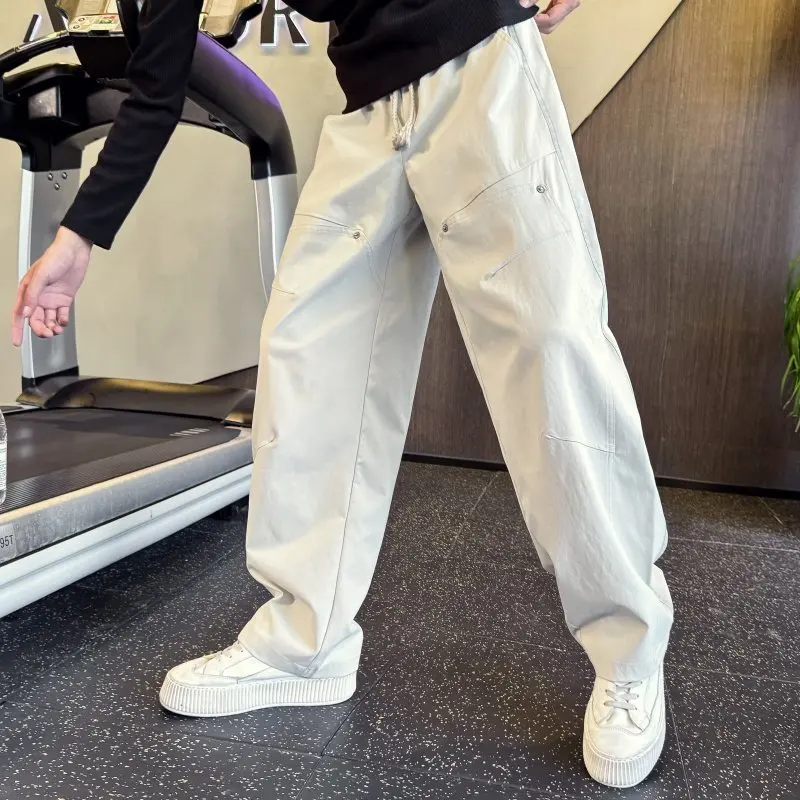 

Мужские повседневные свободные брюки прямого кроя с заклепками, в корейском стиле, весна-осень, с большими карманами, удобные, из полиэфирного волокна