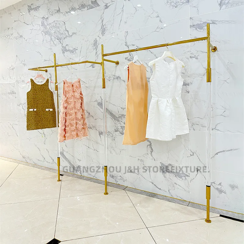 متجر ملابس النساء حامل ملابس أكريليك من الفولاذ المقاوم للصدأ تصميم مخصص رف عرض الملابس المثبت على الحائط