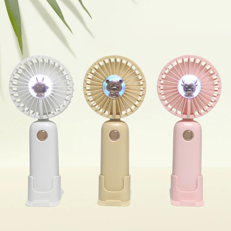 الجملة 1200 مللي أمبير مروحة صغيرة محمولة وحامل الهاتف الذكي قاعدة طاولة قائمة تعمل بالبطارية للاستخدام المنزلي للسيارة والمنزلية