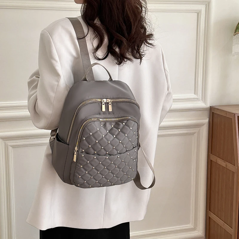 Lingge Rivet Nylon Fabric Design Large Capacity Three Layer Women\'s Backpack Senior Designer Brand Fashion 2023 Youth School Bag