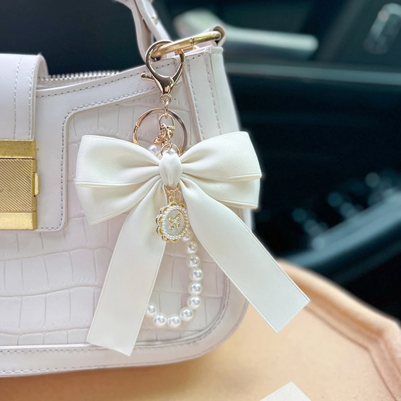 Porte-clés avec nœud créatif et perle, pendentif de sac à la mode pour femmes, porte-clés de voiture, cravate de présidence à ruban personnalisé