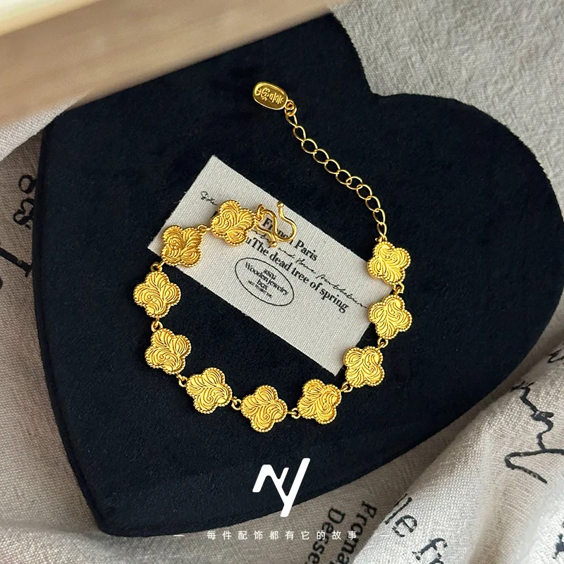 

9999 real glod Design sense Four- Tang grass pattern bracelet, peace and joy Four-leaf Clover versatile bracelet for women