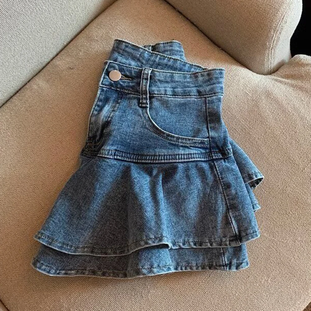 กระโปรงยีนส์สีน้ำเงินทรงเอ สไตล์เค้ก กระโปรงสั้นทรงเอไลน์ แต่งระบายสองชั้น เอวสูง ช่วยให้ดูผอมเพรียว สไตล์ Y2K สำหรับผู้หญิง ประจำปี 2025