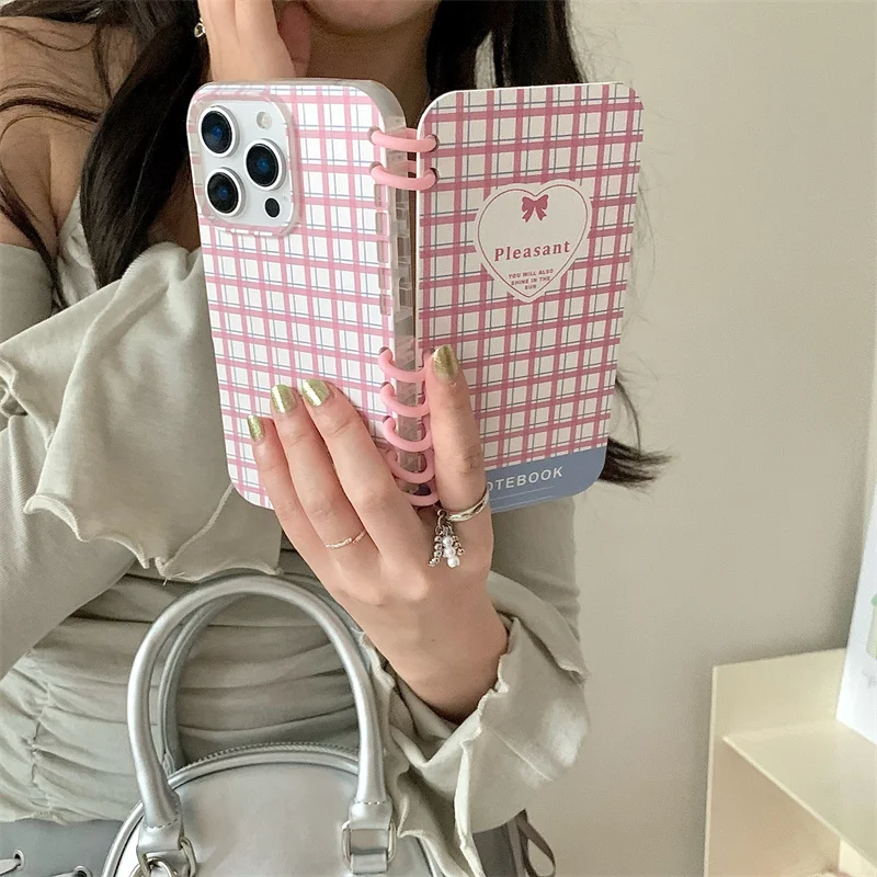 A niche page flipping notebook design with a fresh green pink checkered phone case for iPhone 13 14 15 16 pro max