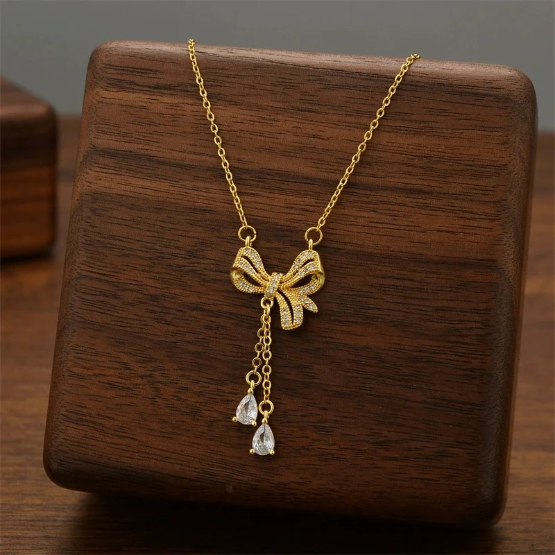 

Stainless Steel Crystal Zircon Bowknot Pendant Necklace For Women Gold Color Bow Water Droplet Tassel Choker Luxury Jewelry Gift
