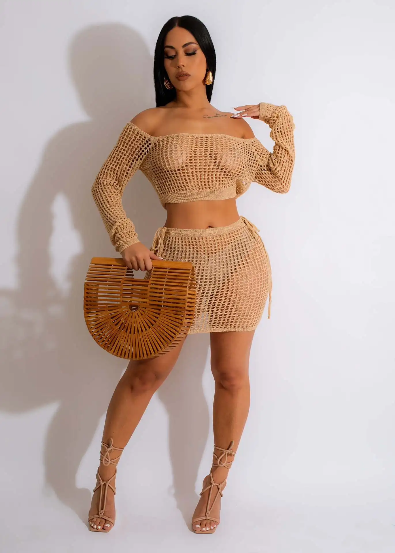 

Women's Summer Knitted Hollowed-Out Lacing Beach Long-Sleeved Top And Mini Skirt Two-Piece Set Solid Color Fashion Skirt Suit