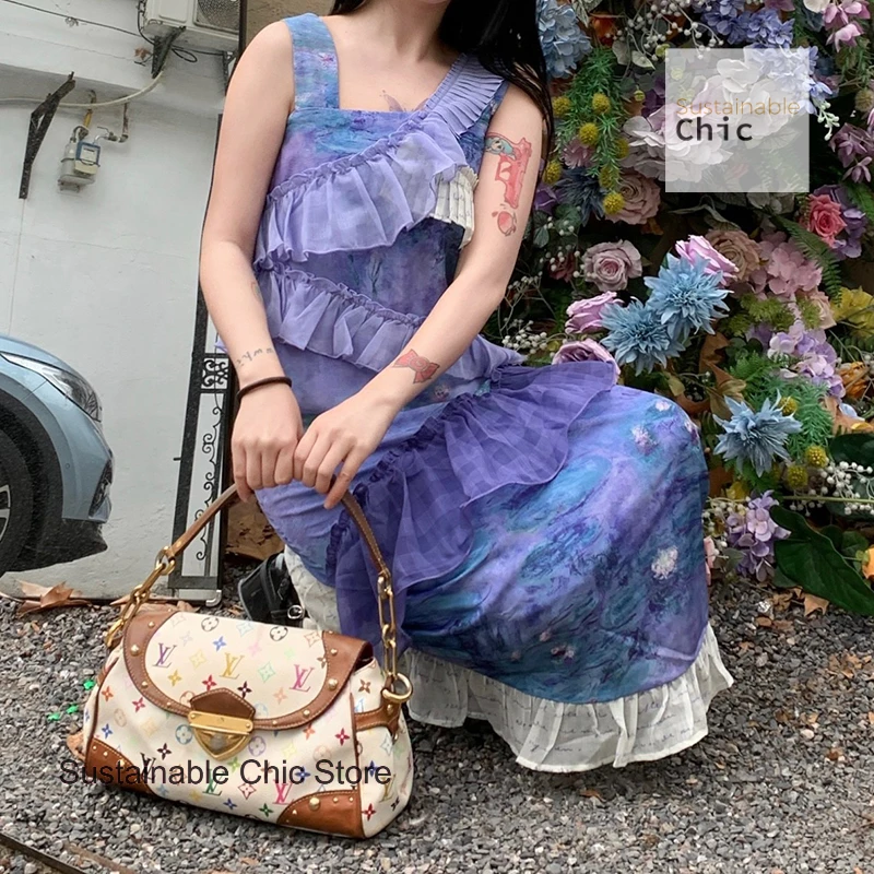 

Beautiful in summer, wearing a purple floral suspender dress, female retro irregular ruffled waist temperament long skirt