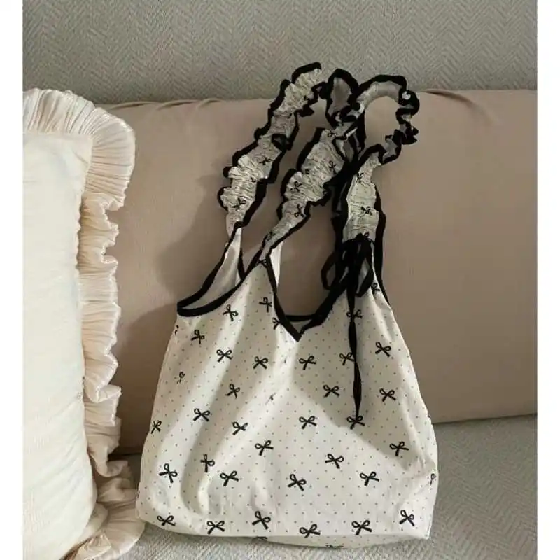 

2025 Hot Korean Niche Bow Polka Dot Canvas Bag, Sweet Girl Drawstring Pleated Handbag, Student Commuting Shoulder Bag