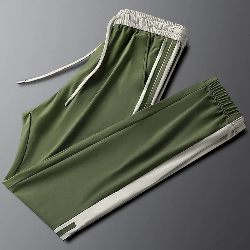 

The men's summer thin men's tight-fitting stretch sweatpants with side stripes are trendy