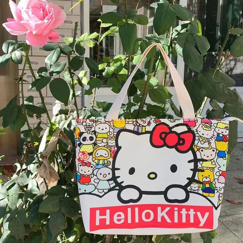 ใหม่ SANRIO Hello Kitty กระเป๋าผ้าใบแบบพกพากระเป๋าสะพายไหล่น้ำหนักเบาความจุขนาดใหญ่สำหรับนักเรียนถุงช้อปปิ้งกระเป๋ากวดวิชา