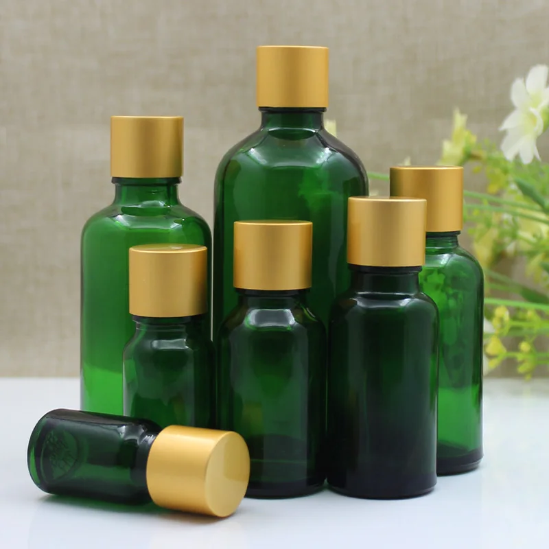 24 pezzi 5 ml 10 ml 15 ml 20 ml 30 ml 50 ml 100 ml Bottiglia di olio essenziale di vetro verde Bottiglia vuota per imballaggio cosmetico Cura personale con coperchio