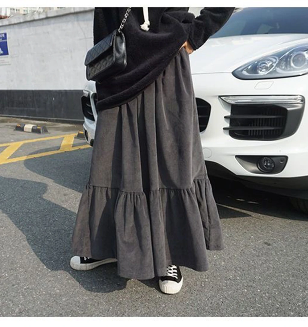 The loose, student-style, retro autumn corduroy fashion A-line all-in-one mid-calf apricot aesthetic skirt from Harajuku