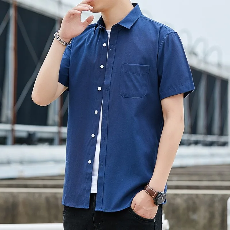 

Мужская однотонная синяя рубашка на пуговицах с короткими рукавами, повседневная хлопковая рубашка большого размера с лацканами и одним карманом, повседневный рабочий топ свободного кроя