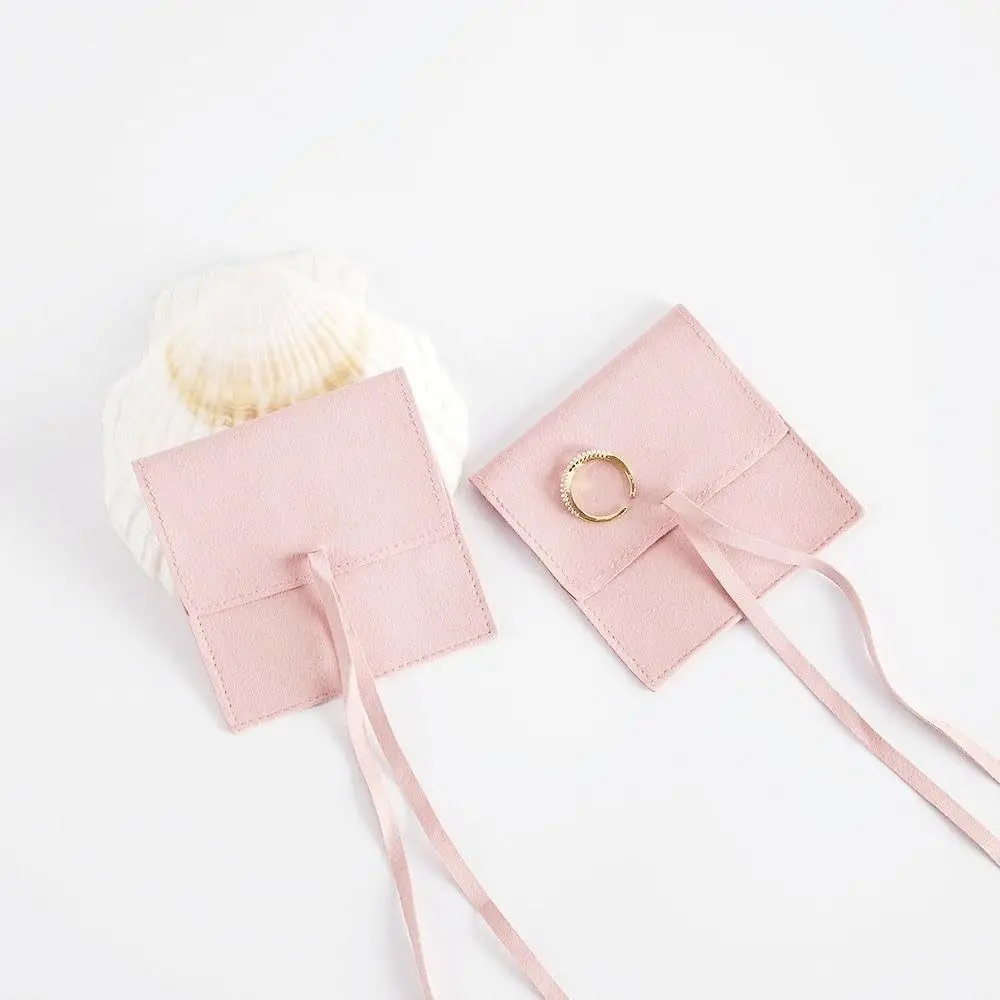 กระเป๋าเครื่องประดับไมโครไฟเบอร์พร้อมสายกระเป๋าทรงซองจดหมายสีชมพูสุดหรูกระเป๋าเครื่องประดับบรรจุภัณฑ์สร้อยข้อมือกระเป๋าผูกโบว์