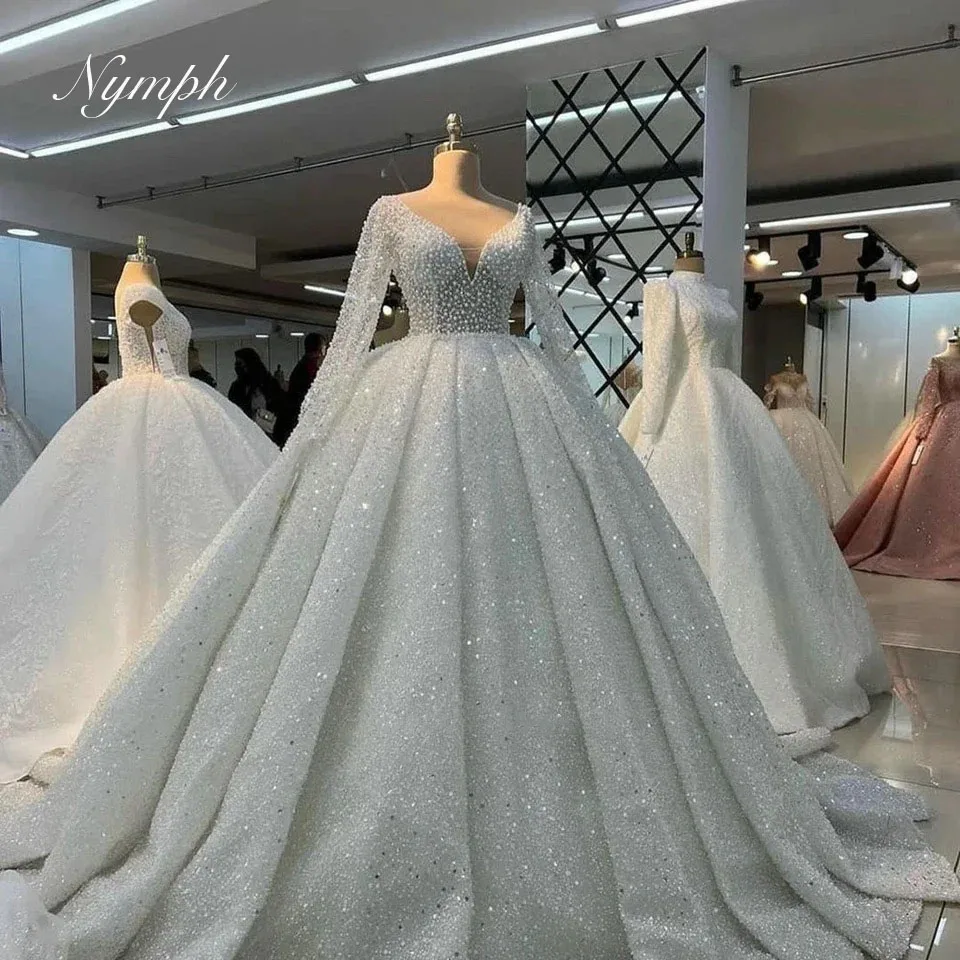 Luxury Pearls Beaded Illusion Ball Gown Wedding Dresses 2025 Arabic Dubai Tulle V-Neck Bride Gowns Vestido De Noiva Customized