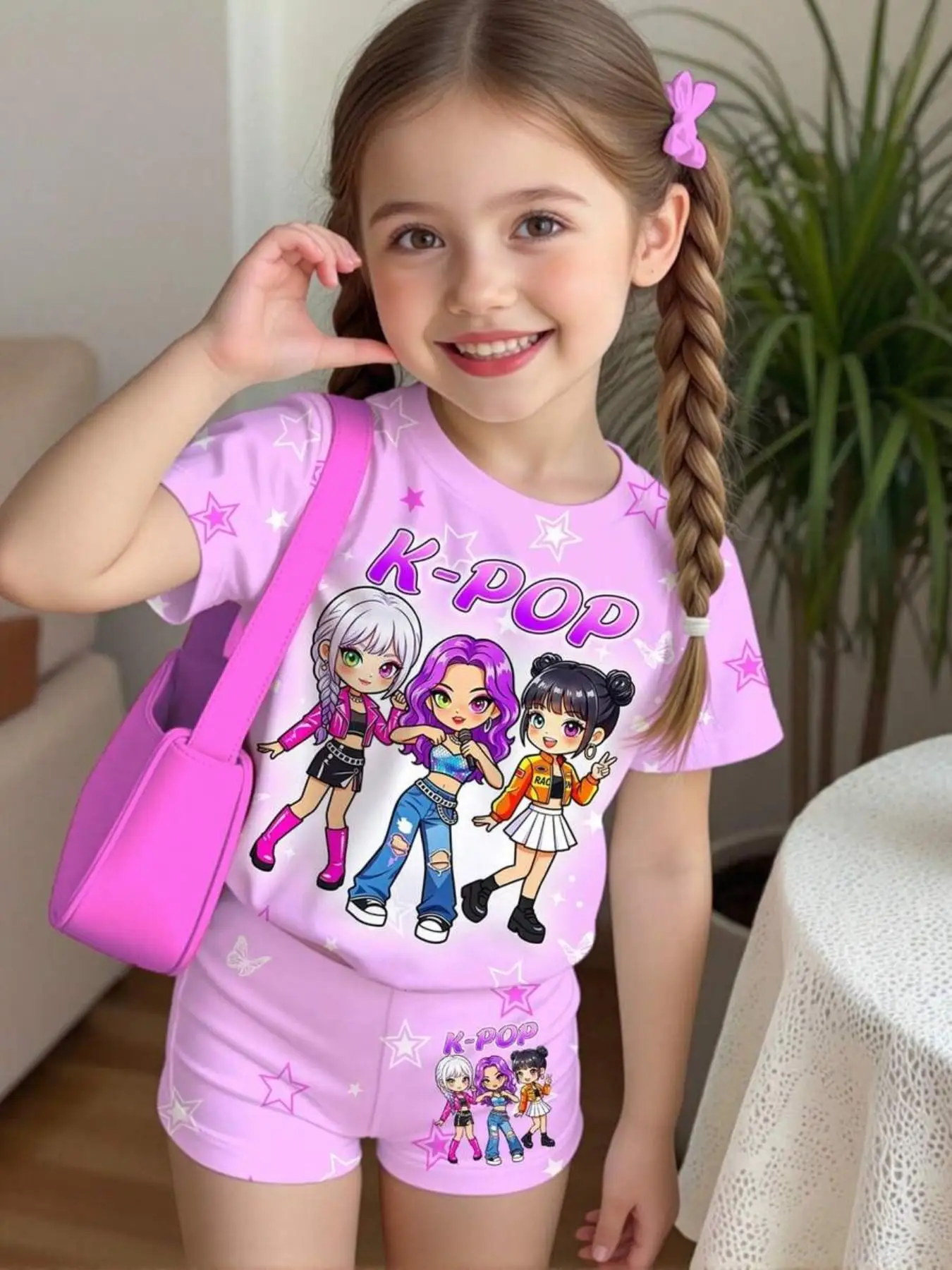 Girls' K-pop-inspired two-piece set featuring an all-over print of stars and butterflies; includes a crew-neck, short-sleeved T-