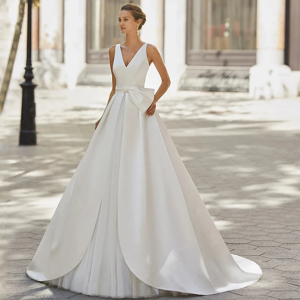 

Elegant Floor Length A-Line Wedding Dresses V-Neck Sleeveless with Bow Belt Satin Backless Romantic Bridal Church Custom Gowns