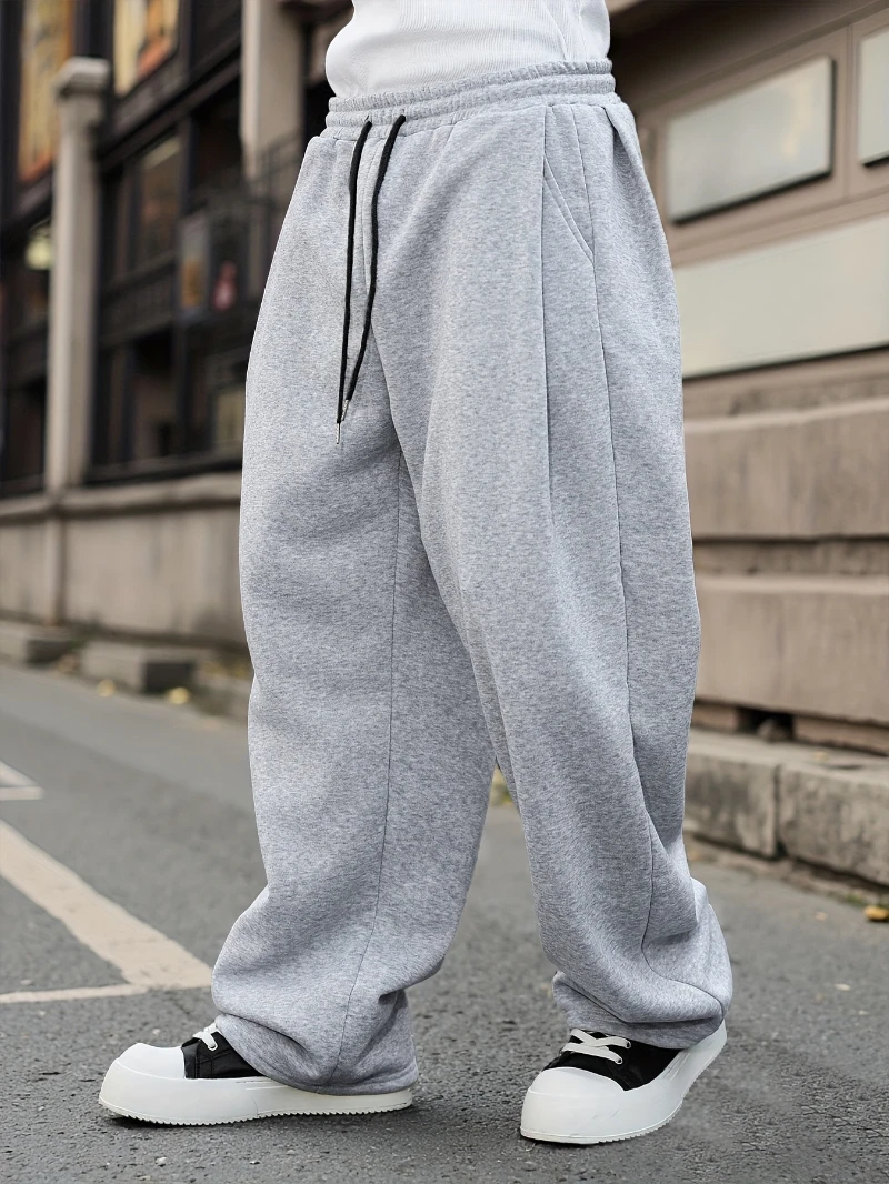 Nuovi pantaloni sportivi da uomo in stile college classico versatile con tasca diagonale e coulisse, colore pulito, autunno e inverno