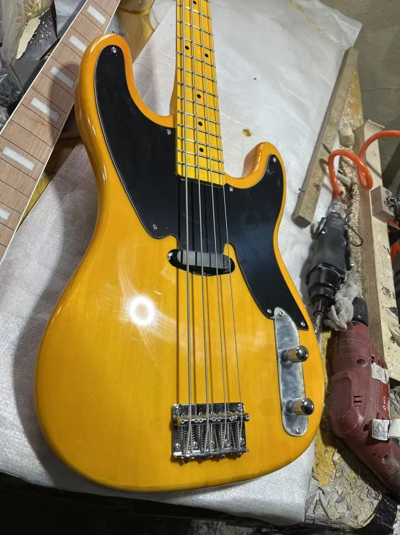 High quality 4-string electric bass,Transparent yellow body and neck,Black pickpocket,Solid wood quality,Free delivery