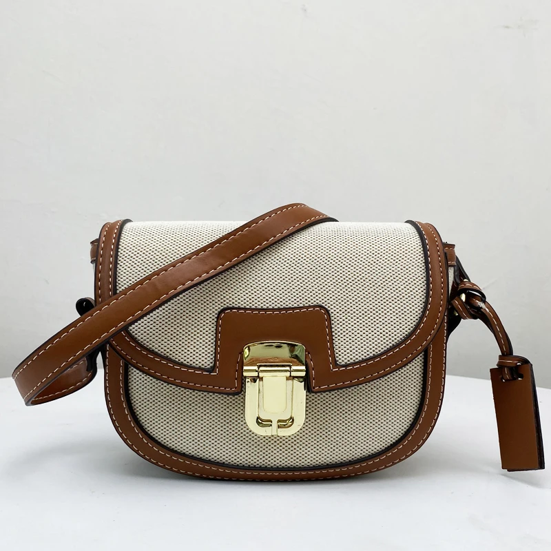 

Vintage Mini Bags For Women Luxury Designer Saddle Shape 2023 New In PU Canvas Stitching Metal Sheet Lock Decoration Crossbody