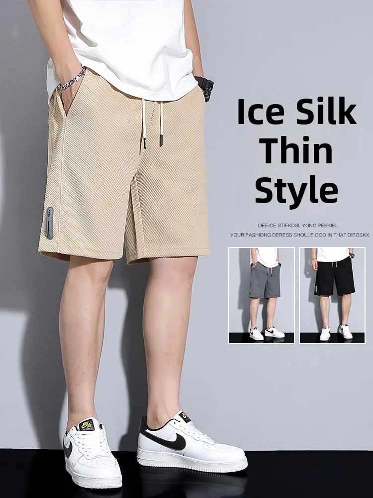 

Summer New Men's Casual Thin Spor orts Loose Fit Sweatpants Versatile Boys' Five-Quarter Length Spor Sle orts