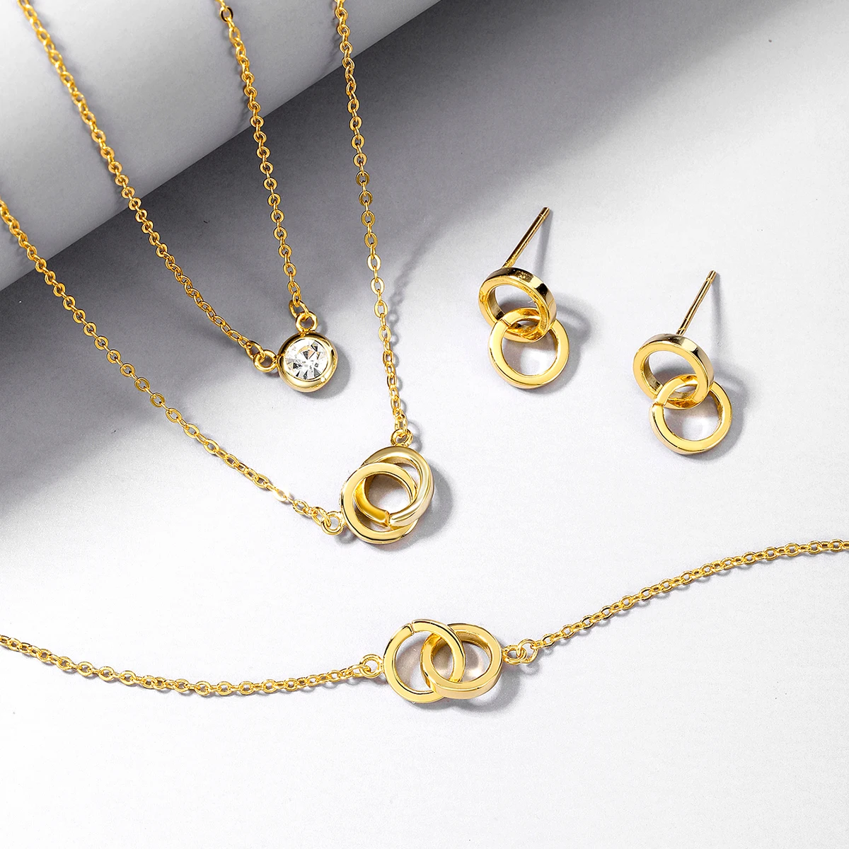 

4-piece set of interlocking double layered necklaces, earrings, bracelets with rhinestones, 925 sterling silver, personalized an