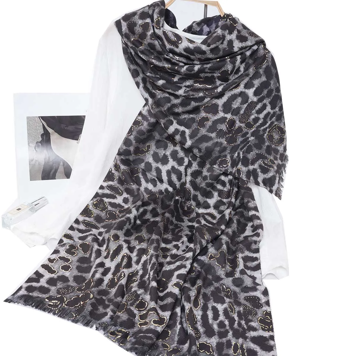 A women\'s leopard print hot stamping warm neck scarf and shawl that can be used as a daily gift