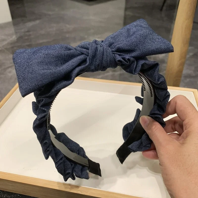 Copricapo da donna popolare Fasce per capelli dentate in tessuto denim arricciato Fasce per capelli annodate con fiocco superiore per le donne Indossa la testa per lo shopping casual