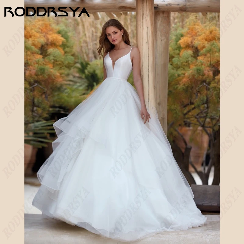 RODDRSYA Correias De Espaguete Vestidos De Casamento V-Neck Satin A-Line Vestidos De Noiva Tulle Lace Backless Praia Noiva Festa Robe De Mariée Correias De Espaguete Vestidos De Casamento V-Neck Satin A-Line Vestidos D