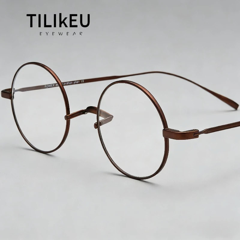 

2026 Новая сверхлегкая художественная круглая оправа для очков из чистого титана для мужчин и женщин, роскошный тренд без носовых подушечек, дизайнерские очки