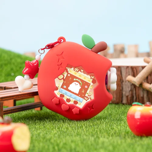 Imagen 1 del producto Funda protectora de silicona para Tamagotchi Paradise, diseño de manzana roja, rosa y verde, con panel de papel decorativo.