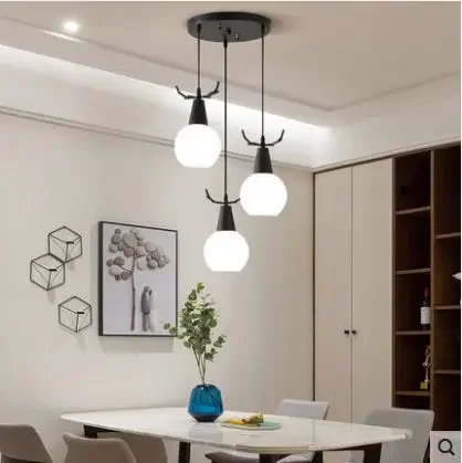 

Restaurant Nordic simple modern three-head creative family dining room table antler lamps