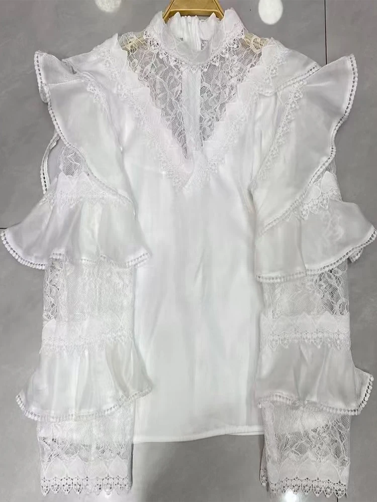 

Autumn 2025 new temperament stand collar stitching lace flared sleeves loose shirt niche design sense fashion blouse.