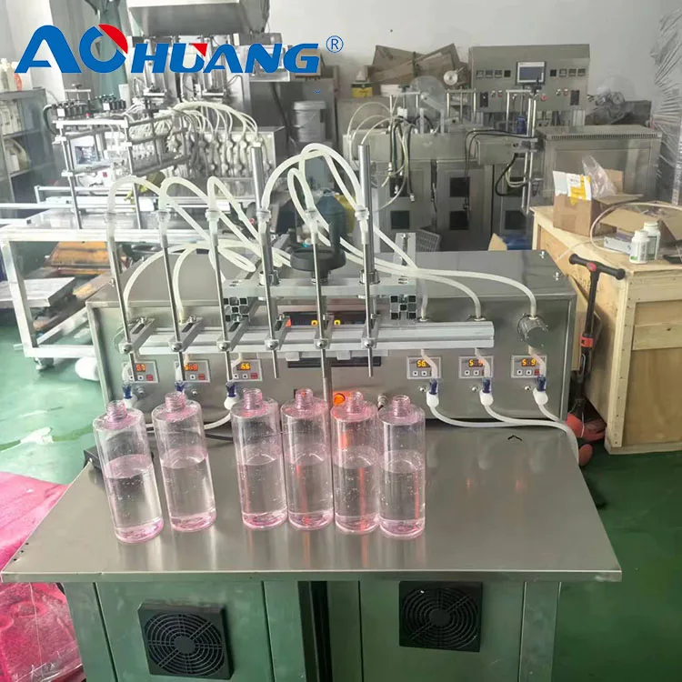 Máquina tampadora de enchimento automática de 4 cabeças Máquina de enchimento de líquidos para garrafa de suco de perfume de óleo essencial