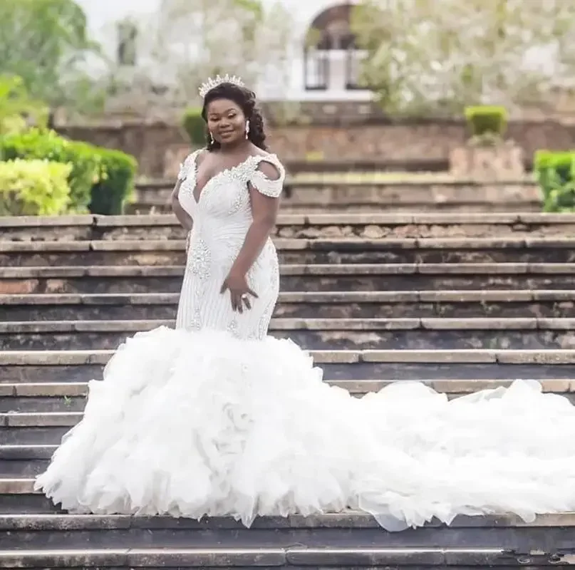 

Customized Crystals Beading Mermaid Wedding DresseBackless Robes De Mariée Off The Shoulder Tiered Ruffles Bridal Gown