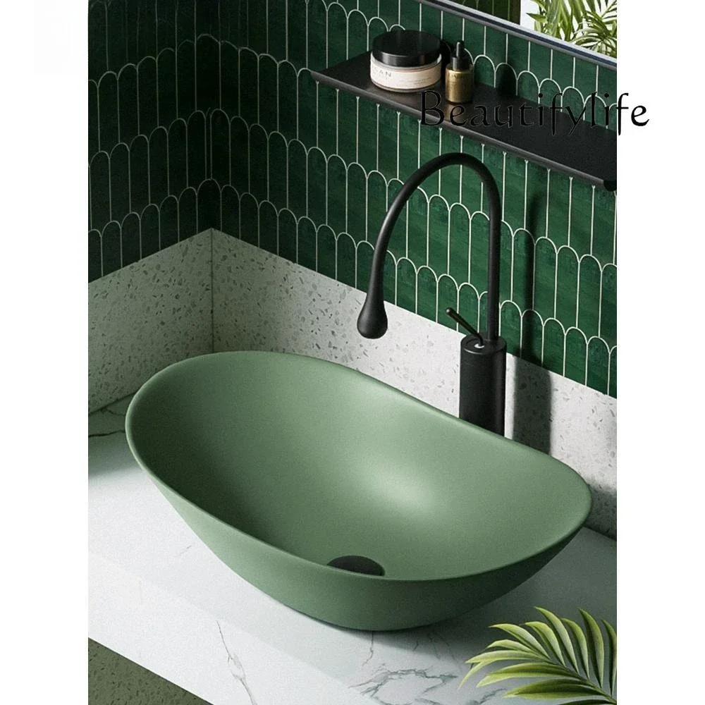 Green washbasin Nordic minimalist creative stage basin ceramic deepening washbasin light luxury washbasin designer model