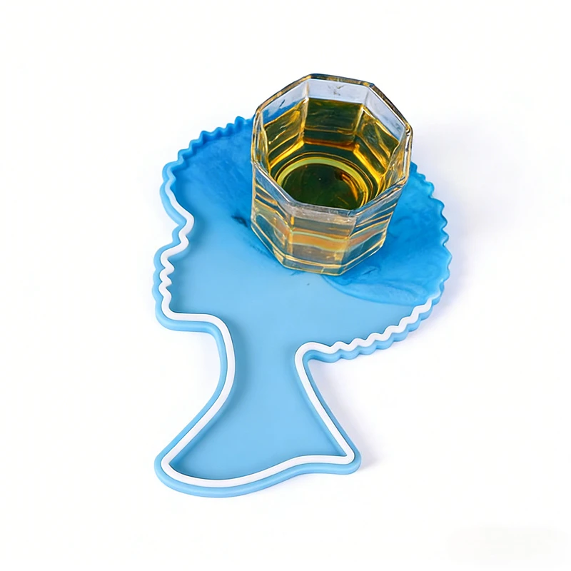 A silicone mold made of epoxy resin for women's avatars which can be used for storing coasters trays and ornaments